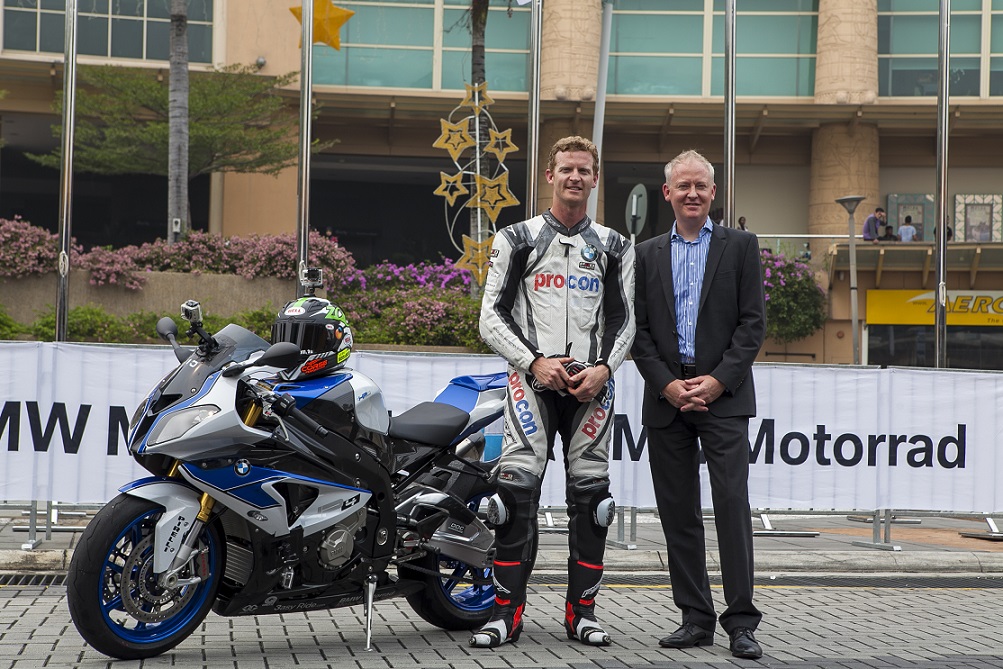 Glenn Allerton and Owen Riley, Head of BMW Motorrad pose in front of the BMW HP4