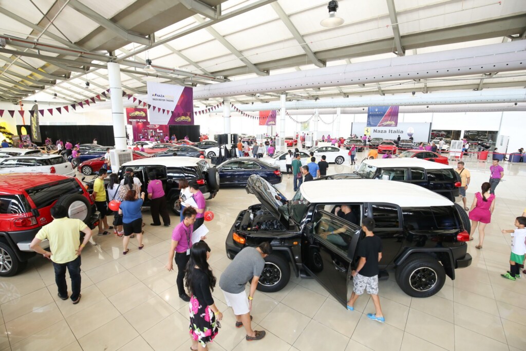 Customers checking out the cars from Naza Motor Trading