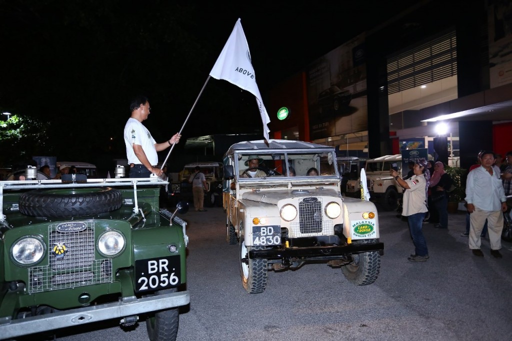 Jaguar Land Rover Malaysia MD Syed Mudzhar Syed ALi flagging off the Series Land Rover May Day Drive convoy from the Jalan Ipoh showroom