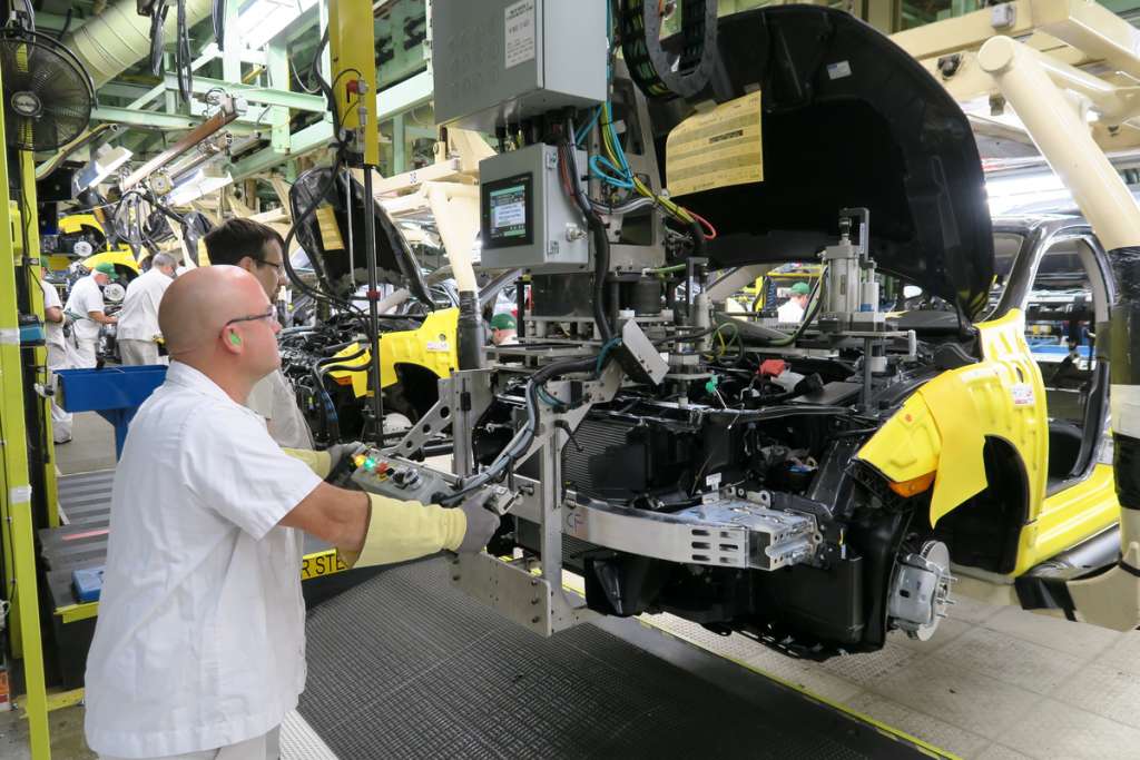 Honda of Canada Mfg. associates install a front-end module on a 2016 Civic Honda Civic Sedan.
