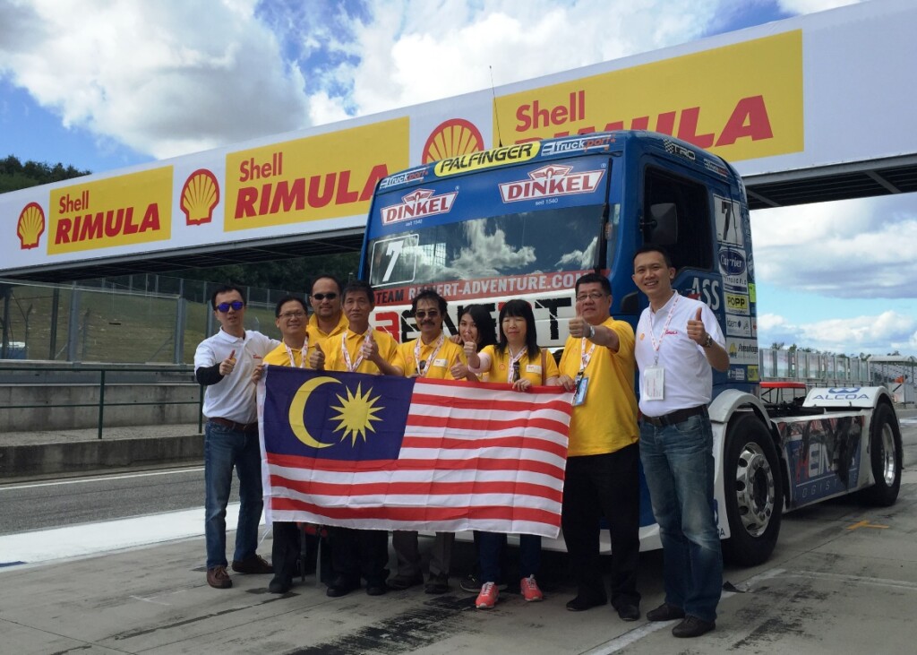 Shell Rimula Brand Manager Damon Chan (L) and Shell Lubricants Marketing Manager Alex Lim with Shell Rimula contest winners in Budapest