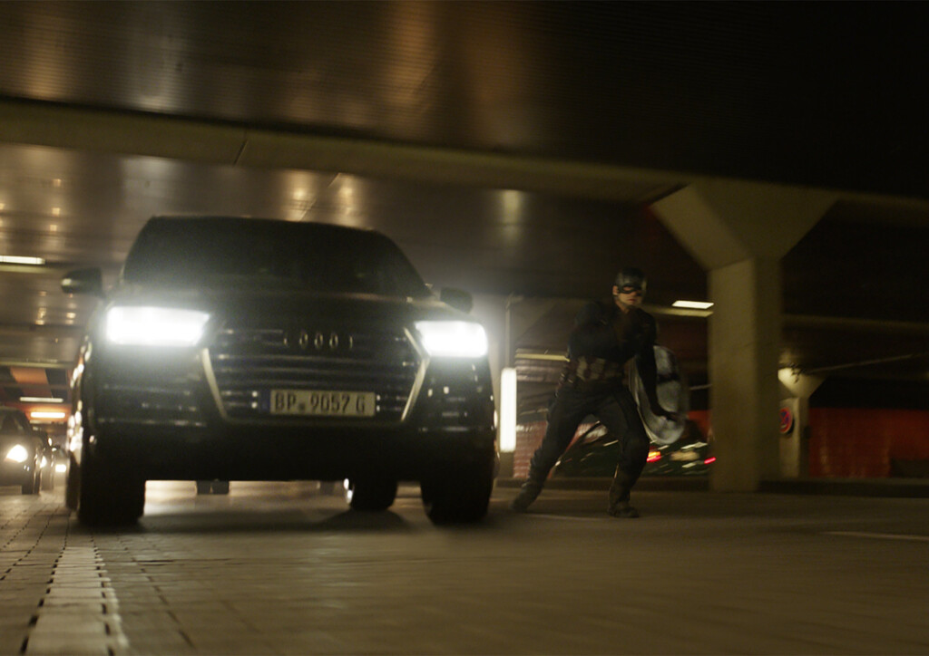 Captain America (Chris Evans) besides an Audi SQ7.