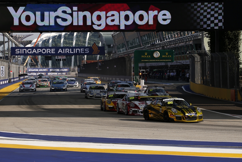 Martin Ragginger (AUT) Team Porsche Holding leads at the start of the race at Porsche Carrera Cup Asia, Rd9, Marina Bay Street Circuit, Singapore, 16-18 September 2016.